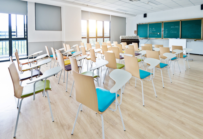 Empty classroom with desks and chairs for music lessons