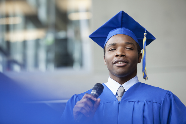male valedictorian speaking at graduation