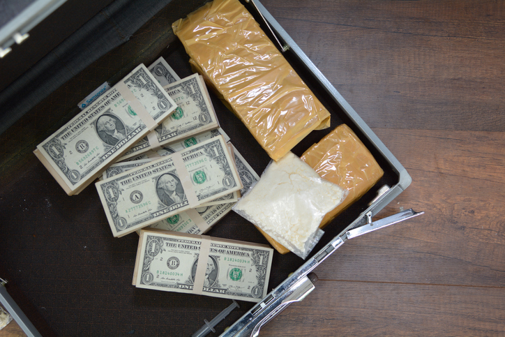 Drug and Dollar Money in suitcase, Drug trafficking, crime.