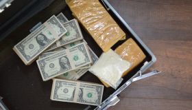 Drug and Dollar Money in suitcase, Drug trafficking, crime.