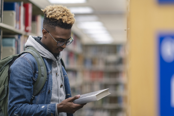 University Male of African Descent finding a book