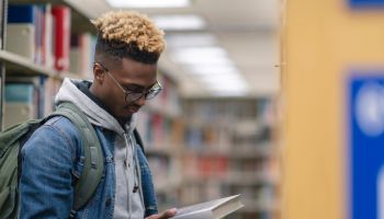 University Male of African Descent finding a book