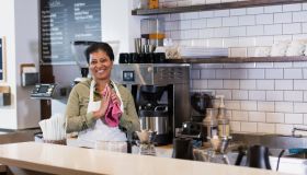 African-American woman working in coffee shop