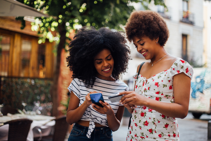 Two girls shop online