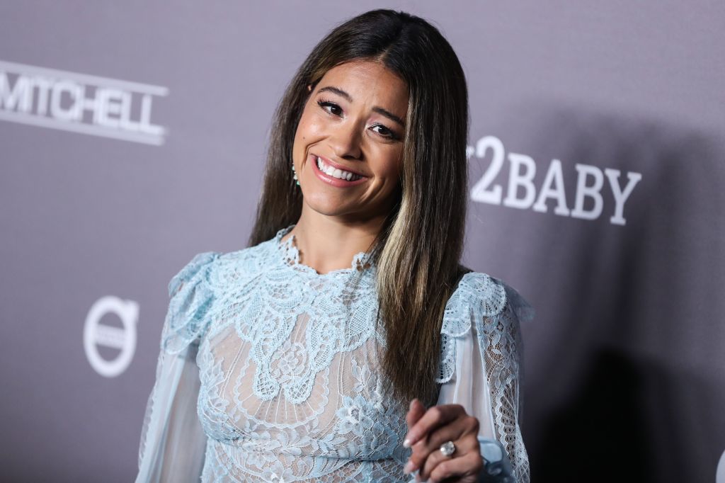 Actress Gina Rodriguez wearing a Zuhair Mirad dress arrives at the 2019 Baby2Baby Gala held at 3Labs on November 9, 2019 in Culver City, Los Angeles, California, United States.