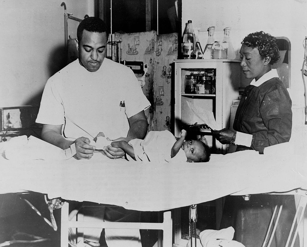 Physician, Nurse, And Baby