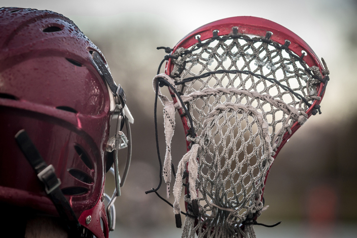 Close Up Of Person Holding Lacrosse Stick