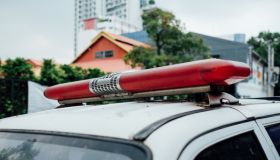 Close-Up Of Police Car Siren Against Building In City