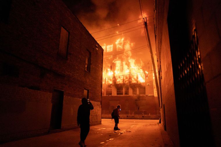 Minnesota community members mourned, protested and looted in reaction to George Floyd dying in police custody