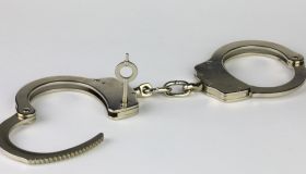 Unlocked Handcuffs on a white background