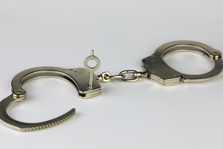 Unlocked Handcuffs on a white background