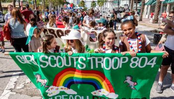 Miami Beach, Veterans Day Parade, Brownies Girl Scouts troop marching with banner