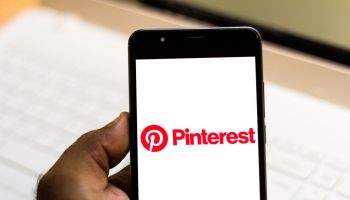 In this photo illustration the Pinterest logo is seen...