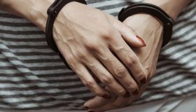 Woman arrested wearing handcuffs