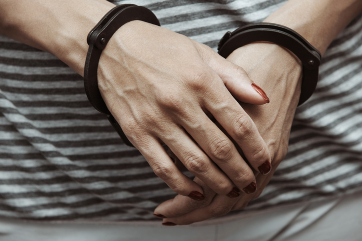 Woman arrested wearing handcuffs