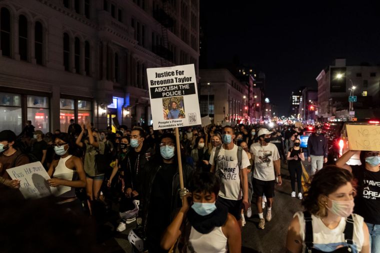 Hundreds of people protest on streets in New York after...