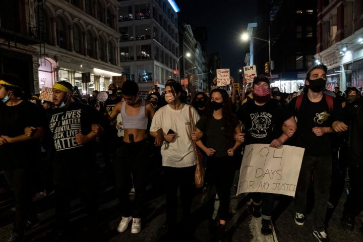 Hundreds of people protest on streets in New York after...