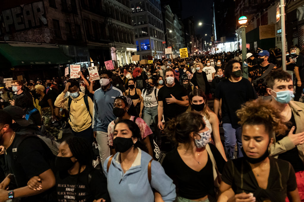 Hundreds of people protest on streets in New York after...