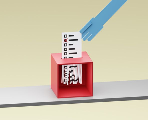 Ballot being shreddered inside a ballot box
