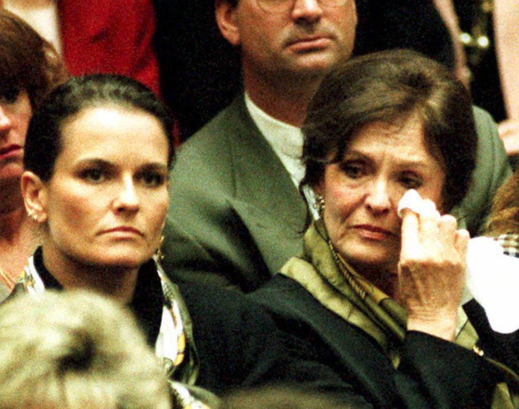 Mother Juditha Brown (R) wipes tears from her eyes