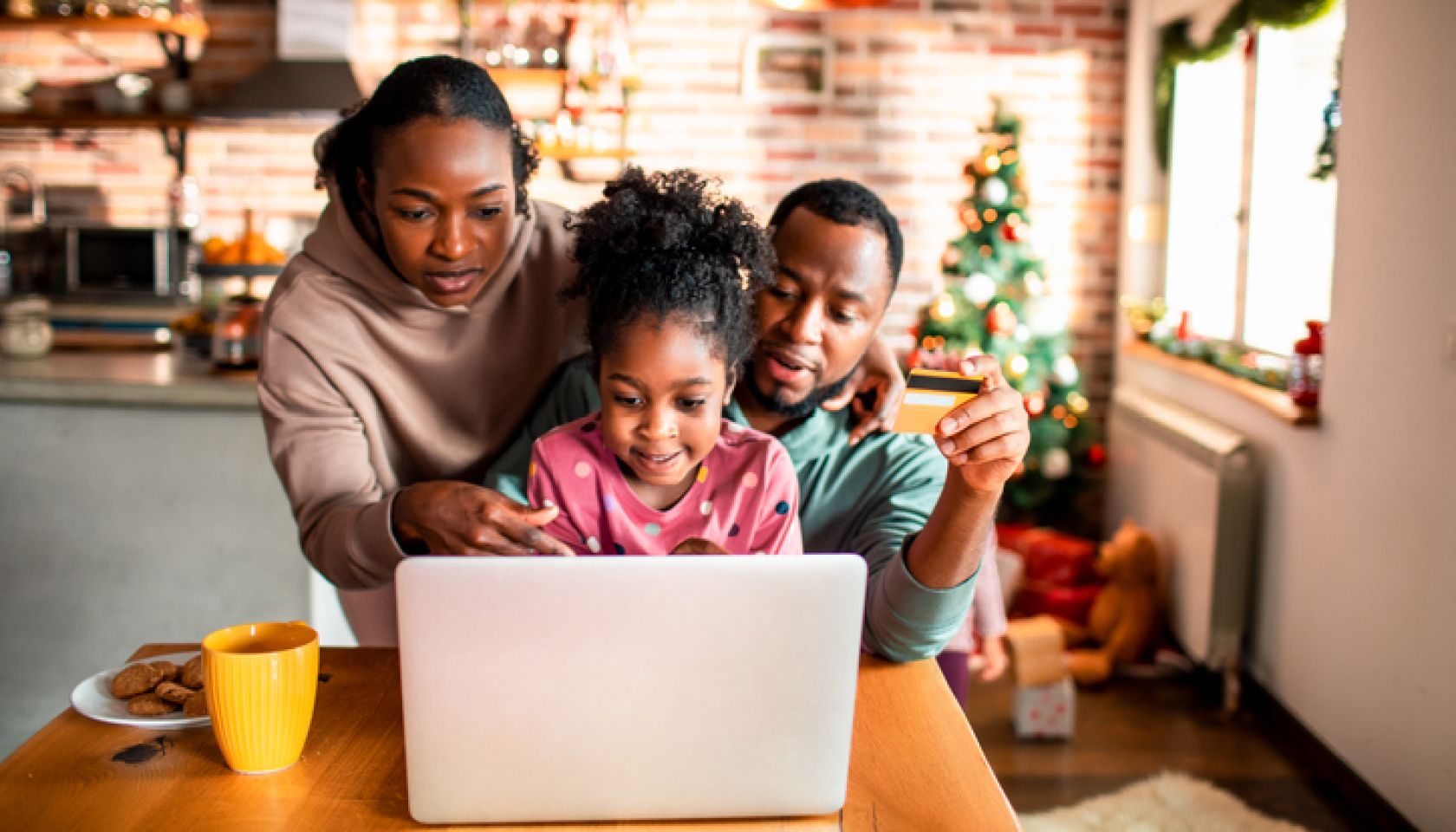 Young family online Christmas shopping