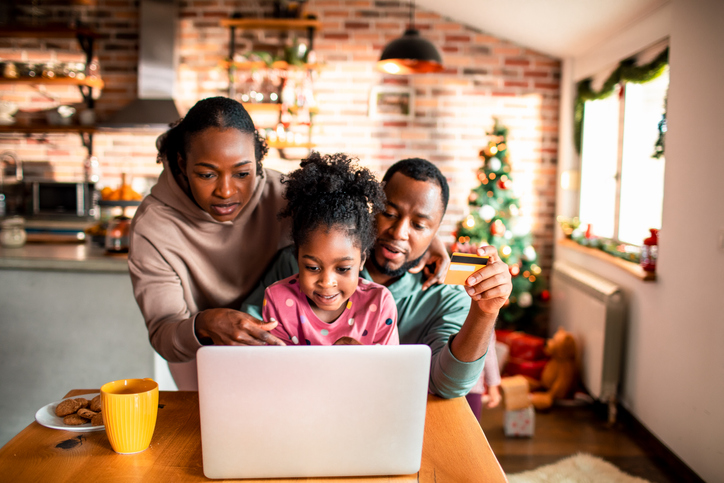 Young family online Christmas shopping