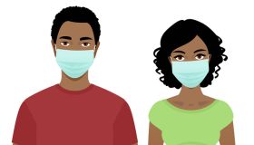 Young man and woman in surgical masks