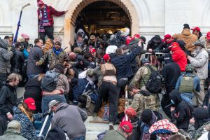 Rioters clash with police trying to enter Capitol building...