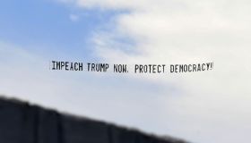 A banner towed by a plane calls for the impeachment of U.S.
