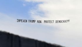 A banner towed by a plane calls for the impeachment of U.S.