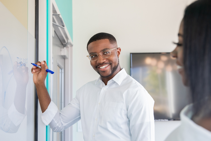 Colleagues discussing new business ideas during meeting