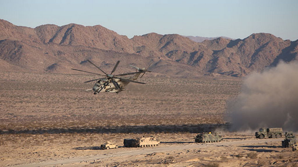 A CH-53E Sea Stallion Helicopter flies in for a simulated medical evacuation during the Tank Mechanized Assault Course aboard Marine Corps Air Ground Combat Center Twenty-nine Palms, California. Dated 2014.