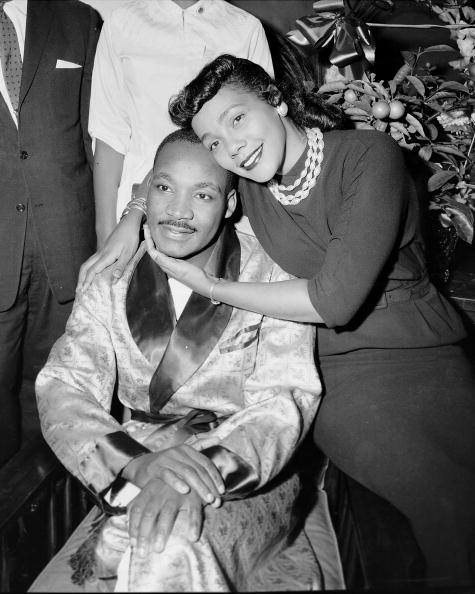 Dr. Martin Luther King and his wife, Coretta, are smiling an