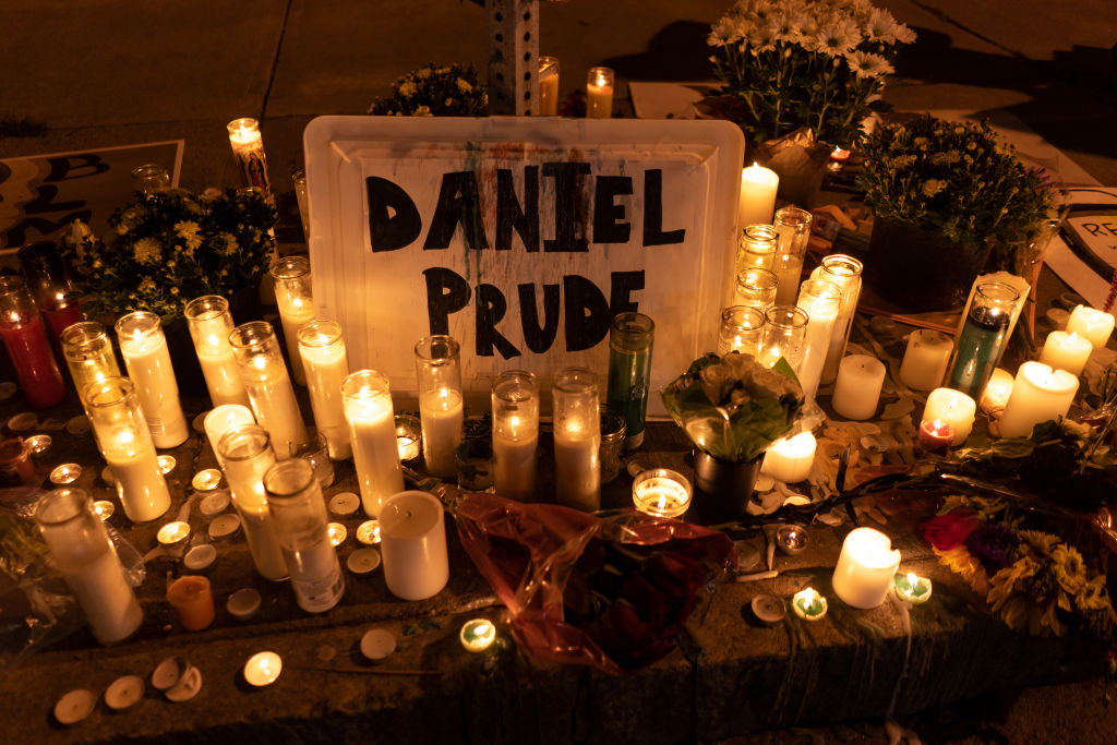 ROCHESTER, NY - SEPTEMBER 3: Candles and flowers are laid out a