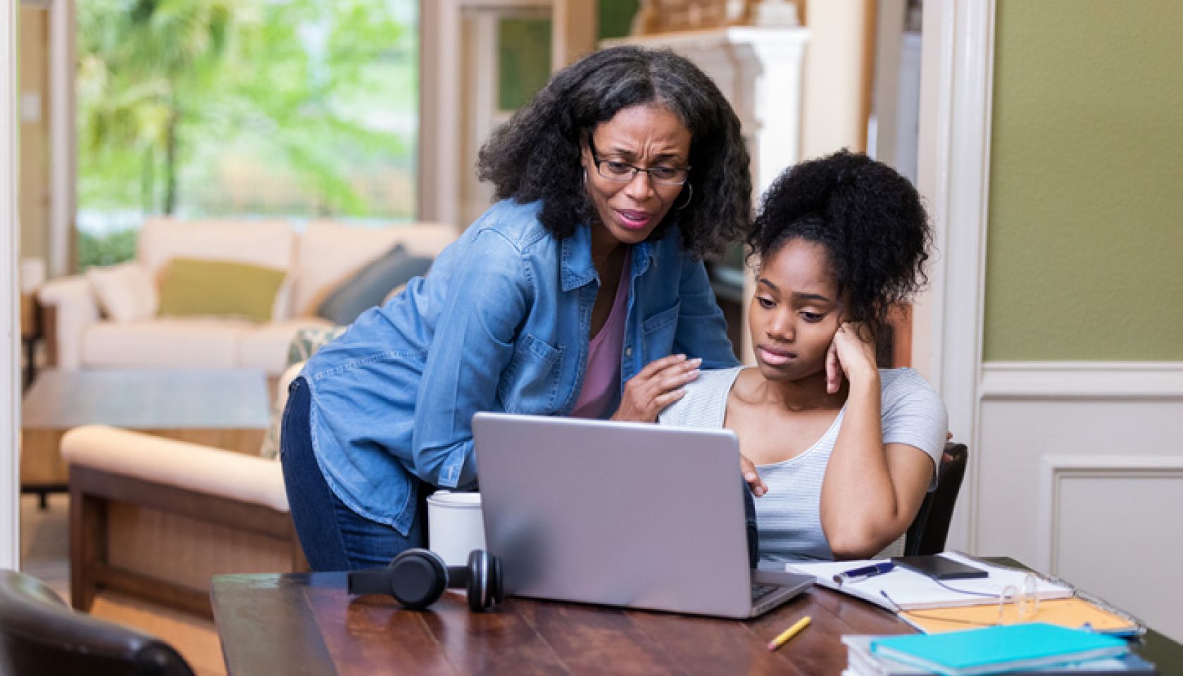 Mature mom comforts upset daughter
