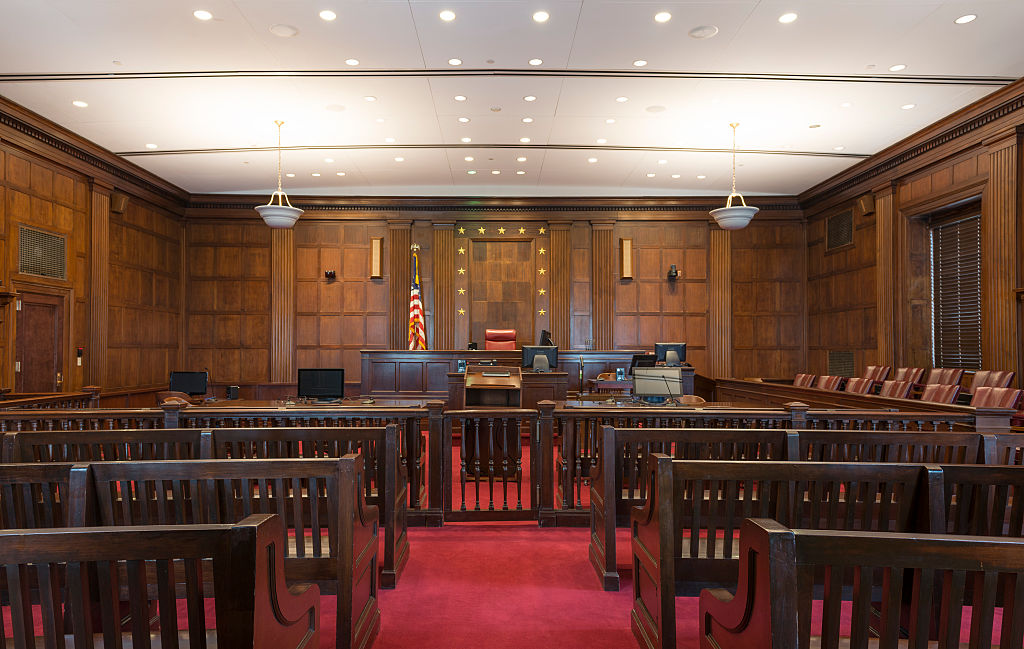 Courtroom. The Robert S. Vance Federal Building and U.S. Courthouse is a four story white marble bui