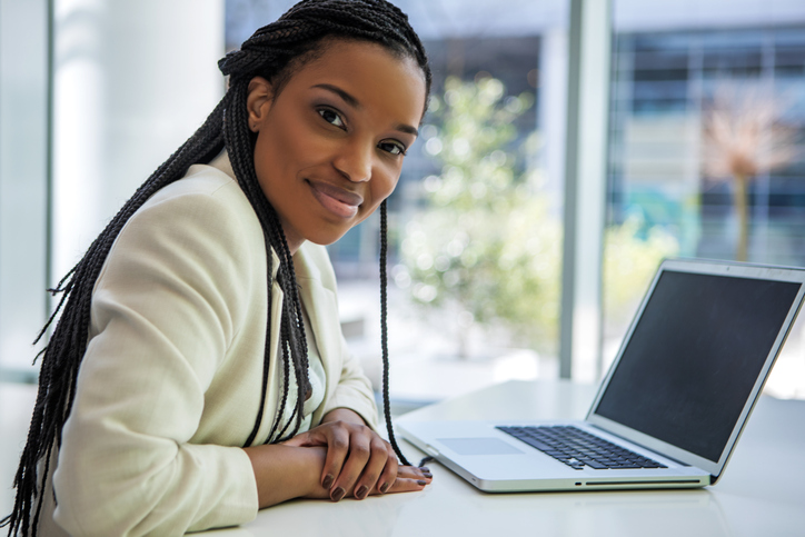 A young black ethnicity female businesswoman at business office reopening