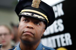 Minneapolis Police Chief Medaria Arradondo left, listened as north side community members held a protest and rally at the 4th precinct on Plymouth avenue in response to the shooting death of Thurman Blevins by Minneapolis Police Sunday June 24, 2018 in M