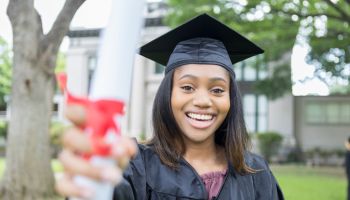 Confident female college graduate