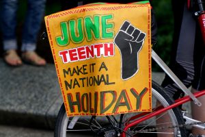 WASHINGTON,DC-JUNE19: Demonstrators take a knee for 8 minutes a