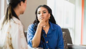 Empathetic therapist listens to female client