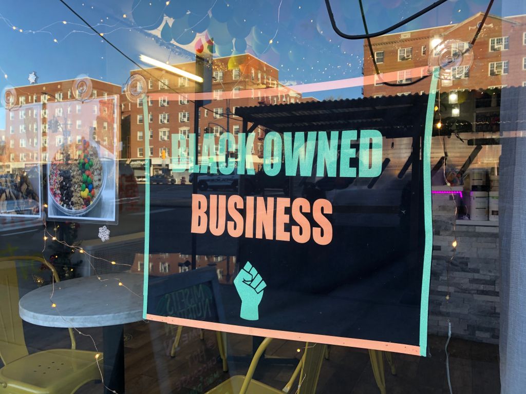 Black Owned Business sign in local storefront window, MisFits Nutrition, Queens, New York