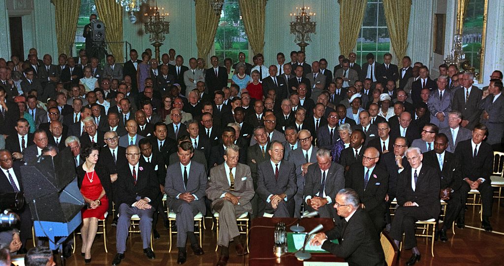 The Civil Rights Act of being enacted by President Lyndon Johnson, July 2, 1964.