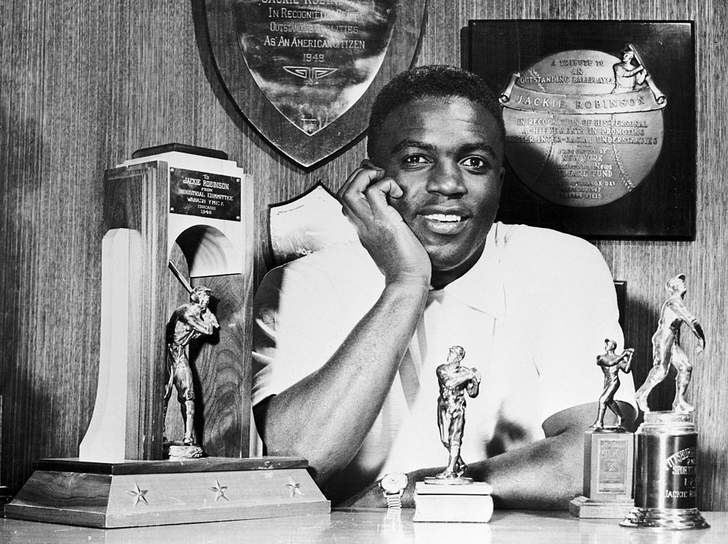 Jackie Robinson at Home With his Various Trophies