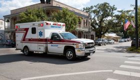Alabama USA, An ambulance on an emergency call trailing through the town center