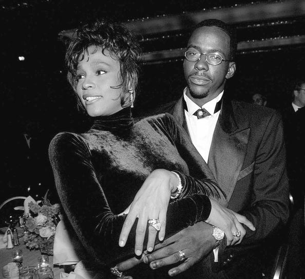 Whitney Houston and husband Bobby Brown at a T.J. Martell be