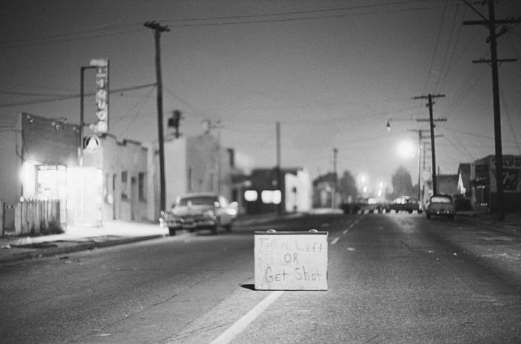 "Turn Left Or Get Shot" Sign In Street