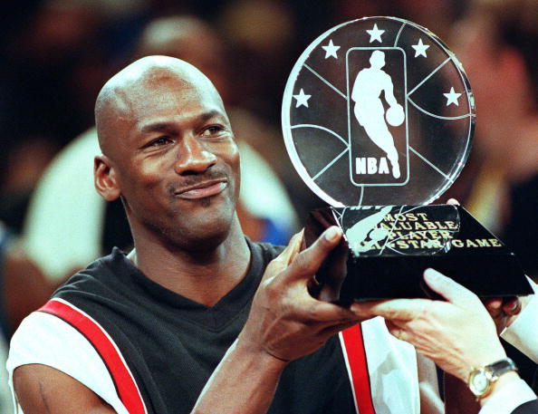 Chicago Bulls' Michael Jordan holds up the Most Va