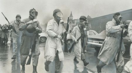 Saving in to crush riot; National Guardsmen wearing gas masks prepare to storm Cellblock D; the stro...