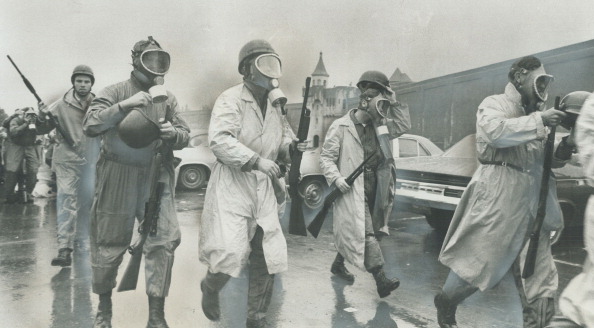 Saving in to crush riot; National Guardsmen wearing gas masks prepare to storm Cellblock D; the stro...